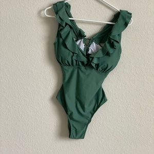 Woman’s size Medium gag teen 1pc Bathing Suit.  Low v-Neck, Low Back,  high Cut